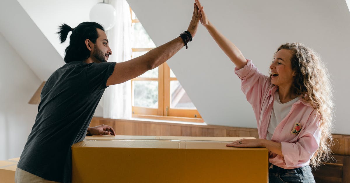 How does one not get hassled for duties/taxes for items that aren't new but look new? - Exited diverse couple relocating in new apartment How does one not get hassled for duties/taxes for items that aren't new but look new? - Exited diverse couple relocating in new apartment