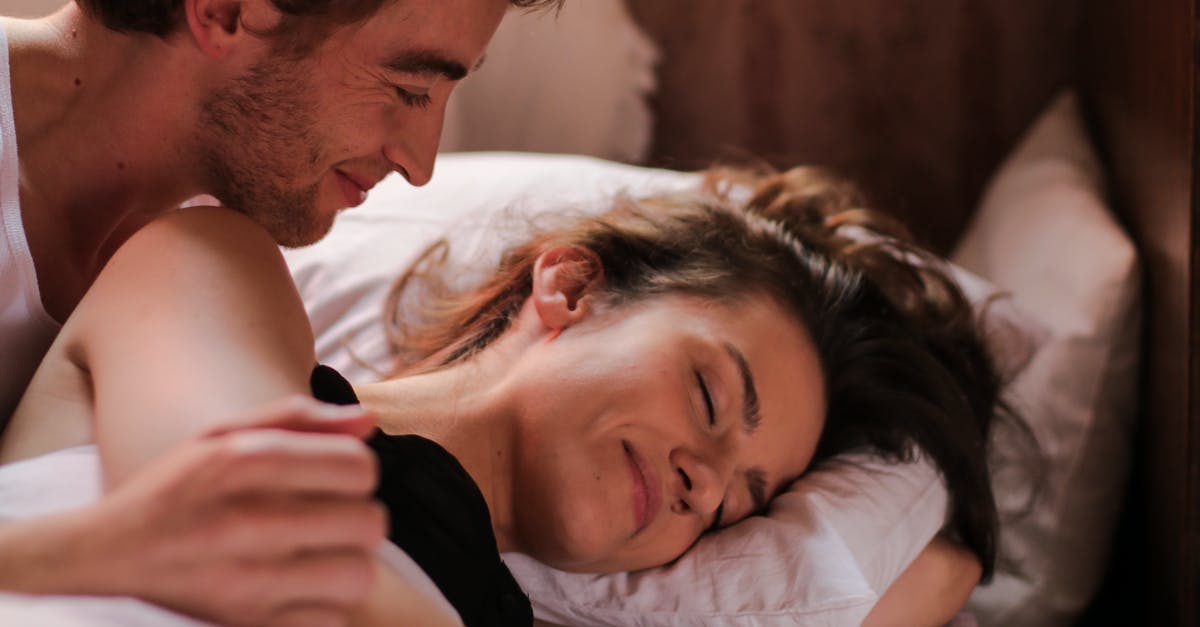 How does one sleep in a sleeper train in Europe? - Man and Woman Lying on Bed How does one sleep in a sleeper train in Europe? - Man and Woman Lying on Bed