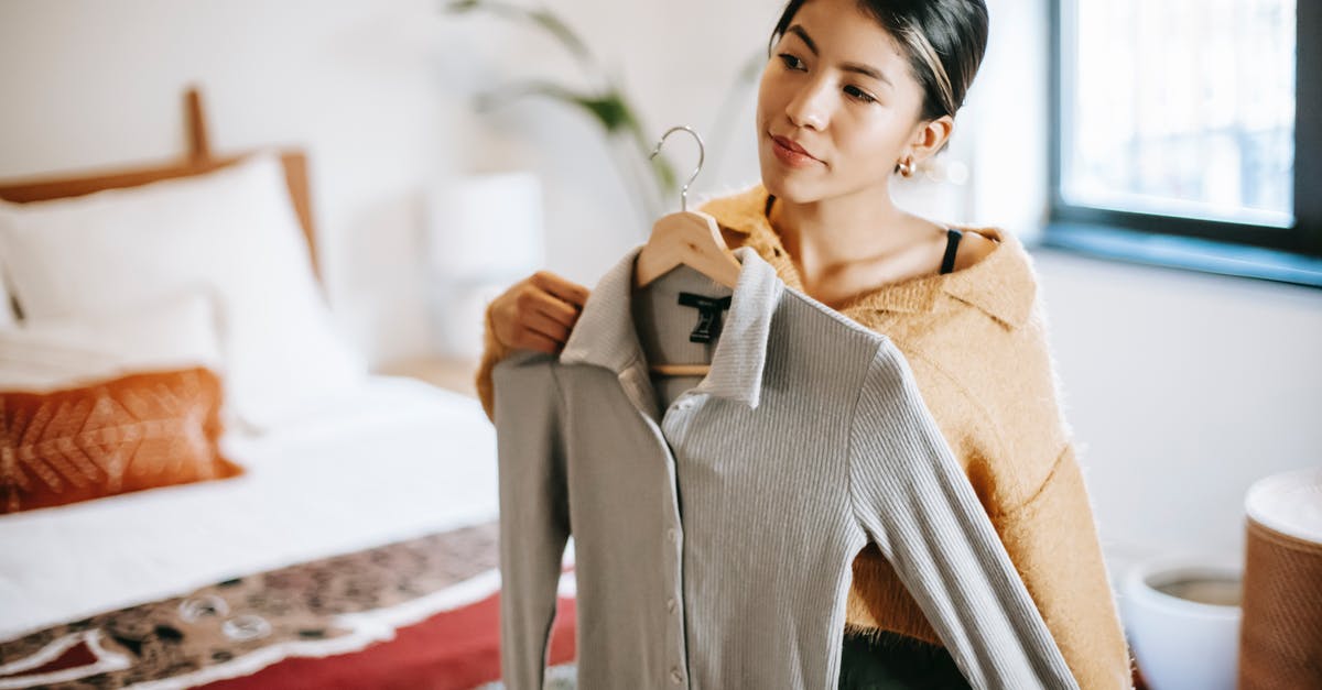 How does the CDC decide whether an itinerary **requires** an overnight connection? - Asian woman trying on clothes in bedroom How does the CDC decide whether an itinerary **requires** an overnight connection? - Asian woman trying on clothes in bedroom