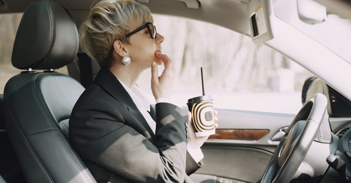 How does TSA ensure only Pre-Checked passengers go through Pre-Check? - Focused woman looking at mirror in car How does TSA ensure only Pre-Checked passengers go through Pre-Check? - Focused woman looking at mirror in car