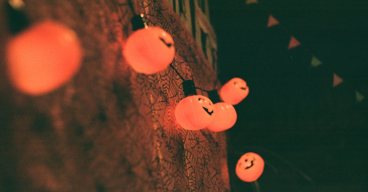 How far away from artificial light do you need to get to experience the night sky without light polution? - Glowing pumpkin lamps hanging on wall during Halloween celebration How far away from artificial light do you need to get to experience the night sky without light polution? - Glowing pumpkin lamps hanging on wall during Halloween celebration