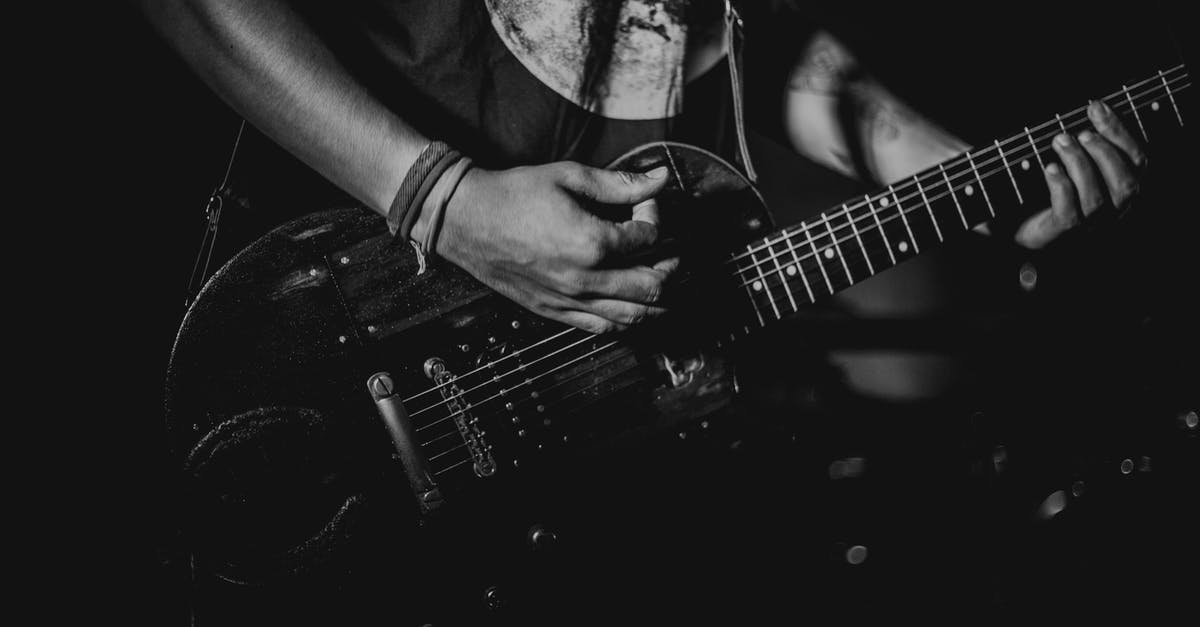 How I can find out about rock concerts in Tallinn? - Man Playing Guitar How I can find out about rock concerts in Tallinn? - Man Playing Guitar