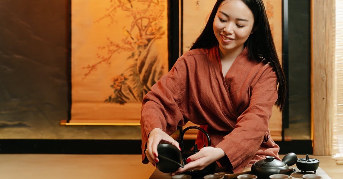 How is the renewing process like for an expired Chinese residence permit on expired passport? [closed] - A Woman in a Robe Pouring Tea on Teacup