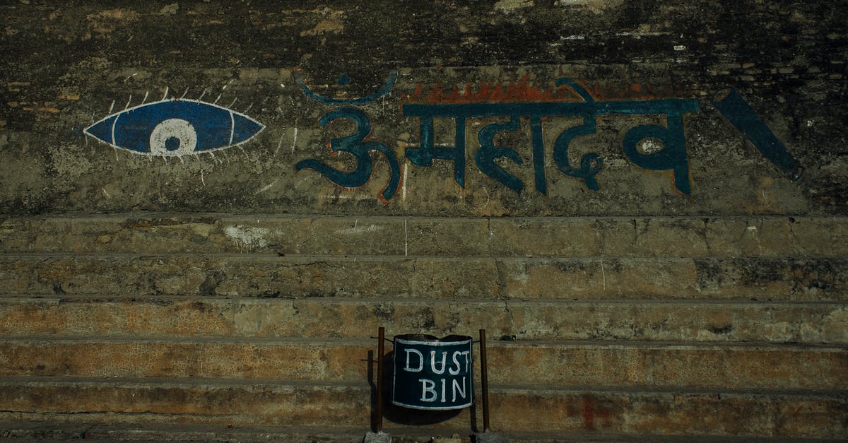 How long before I can re-enter the UK after Leave to Remain refusal? - Shabby stone wall with eye ornament and Hindi inscription