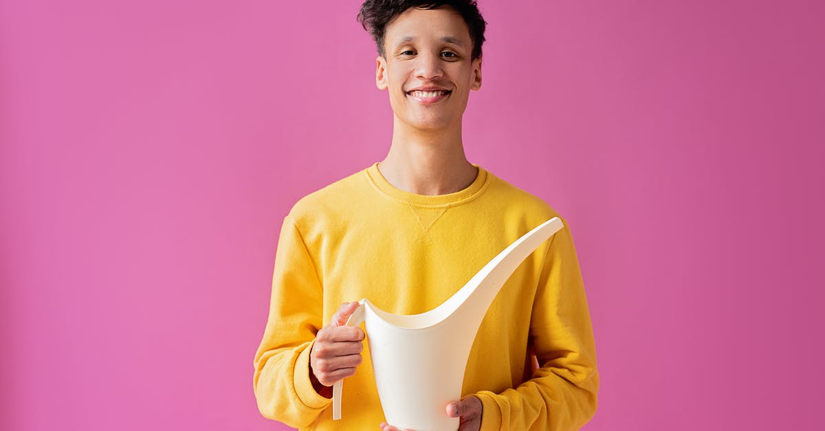 How long can I stay in Finland? [duplicate] - A Handsome Young Man Holding a Long Spout Plastic Watering Can
