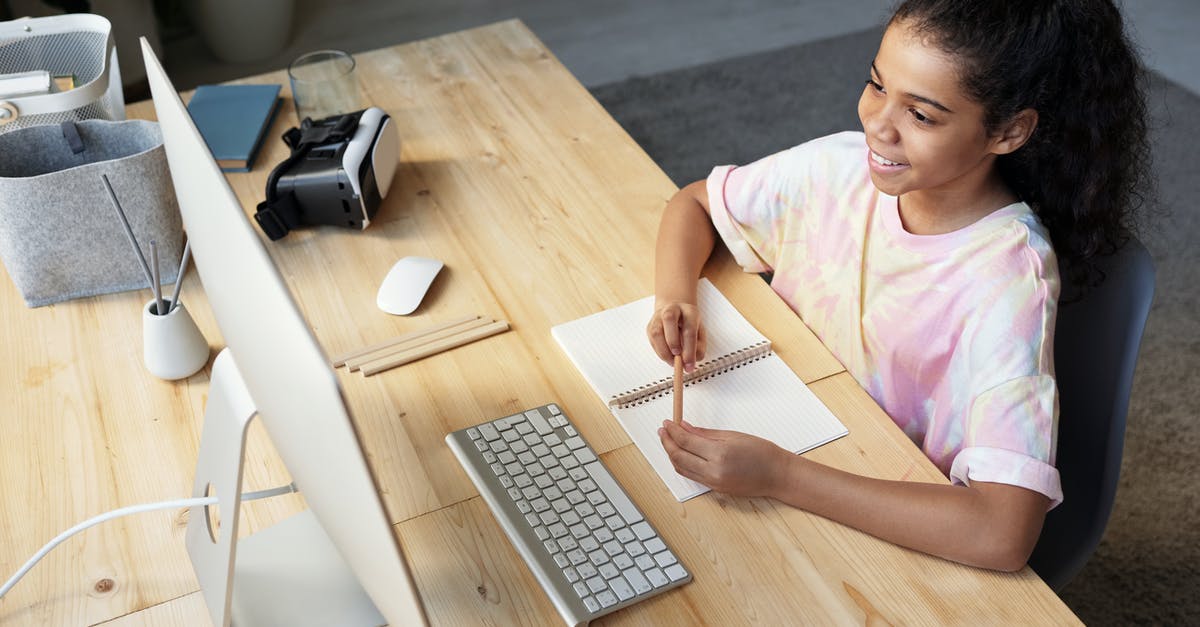 How long can phd students stay in the US after study [closed] - Girl in Pink T-shirt Looking at the Imac