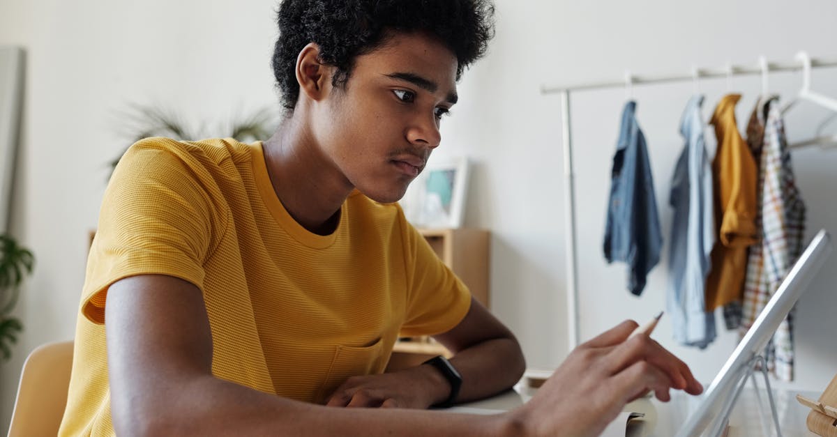 How long can phd students stay in the US after study [closed] - Man in Yellow Crew Neck T-shirt While Using Tablet
