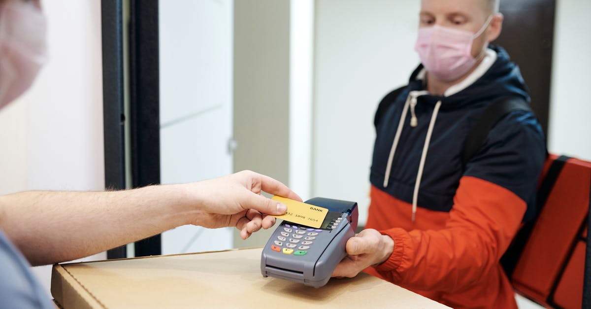 How long does a Ryanair payment stay pending? - Person Paying for Food Delivery with a Credit Card How long does a Ryanair payment stay pending? - Person Paying for Food Delivery with a Credit Card