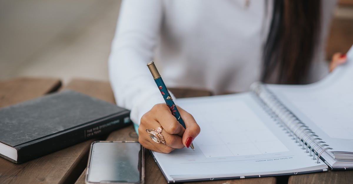 How long does it take for Ireland to process a work permit and entry permit? [closed] - Crop office employee taking notes in notebook at table