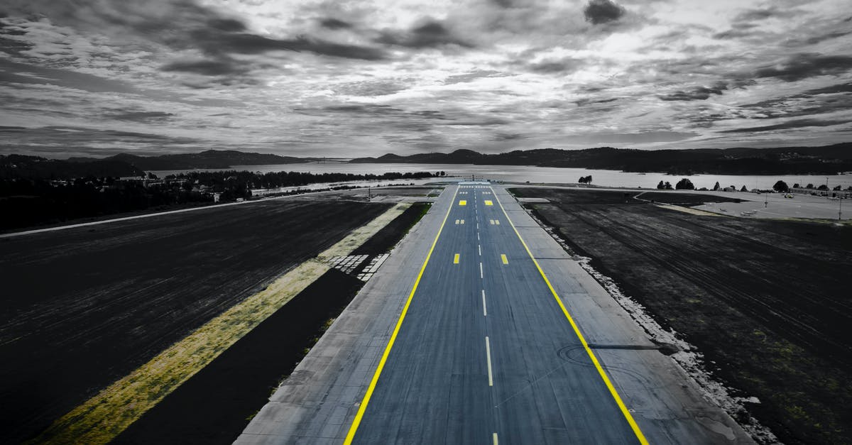 How long does it take to drive from Heathrow airport to Covent Garden? - Aerial Photography of Grey Concrete Road