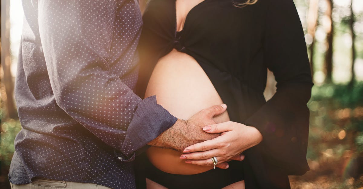 How long should I wait to take my parents on B2 visa to USA? [closed] - Man Touching Woman's Baby Bump