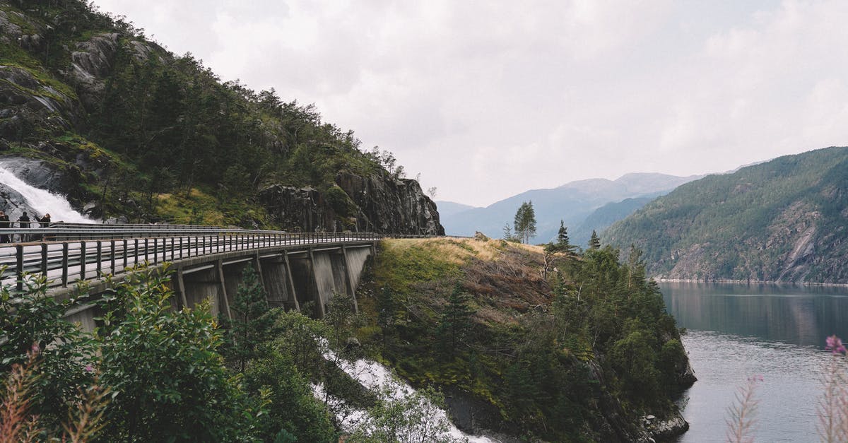 How many km per day in on the road trip to patagonia? [closed] - Picturesque landscape of rough mountain river running through mountainous terrain towards lake under bridge in overcast day