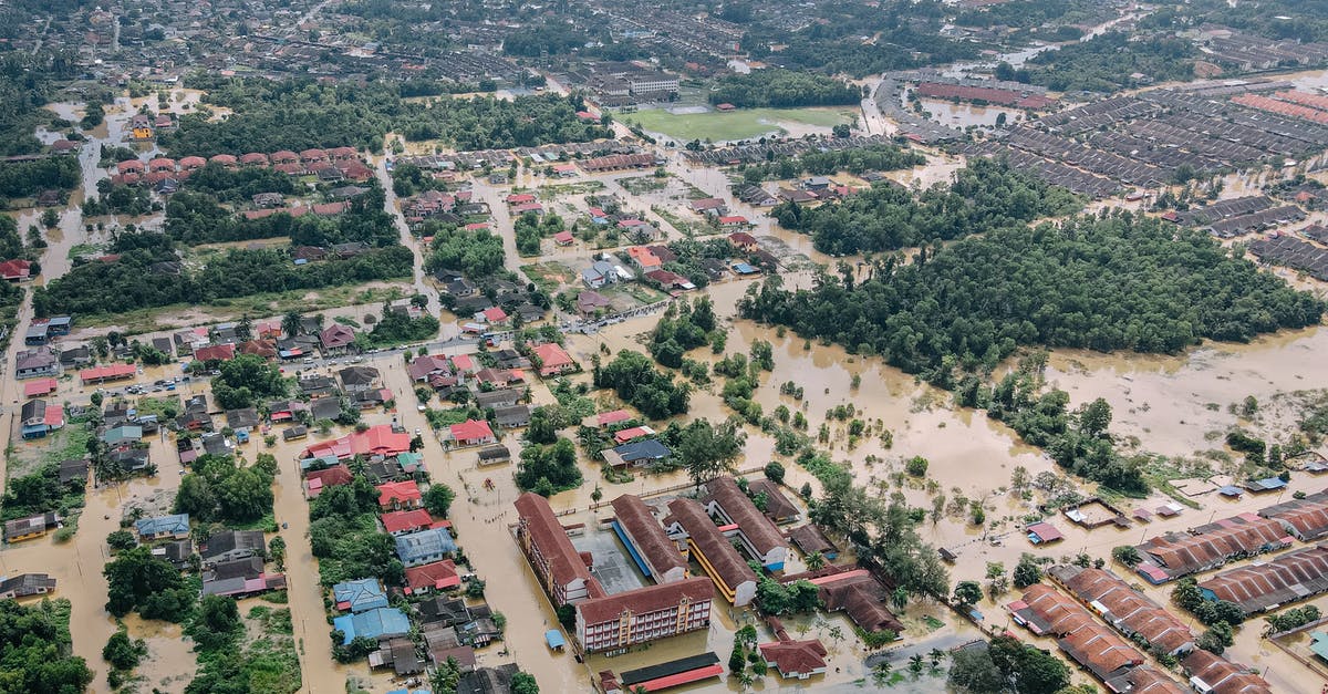 How many years am I banned from entering the Schengen Area? - Aerial view of flooded small town with many residential houses and lush green trees How many years am I banned from entering the Schengen Area? - Aerial view of flooded small town with many residential houses and lush green trees