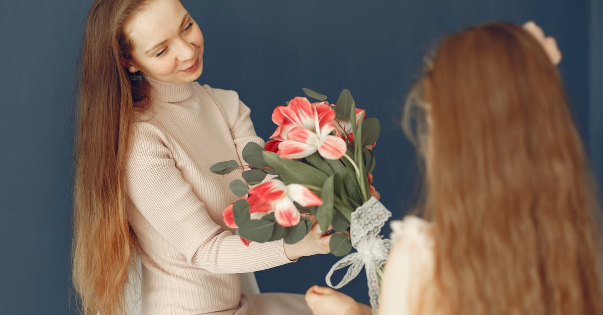 How much cash should I give my daughter for month long Japan trip? [closed] - Happy daughter giving flowers to mother