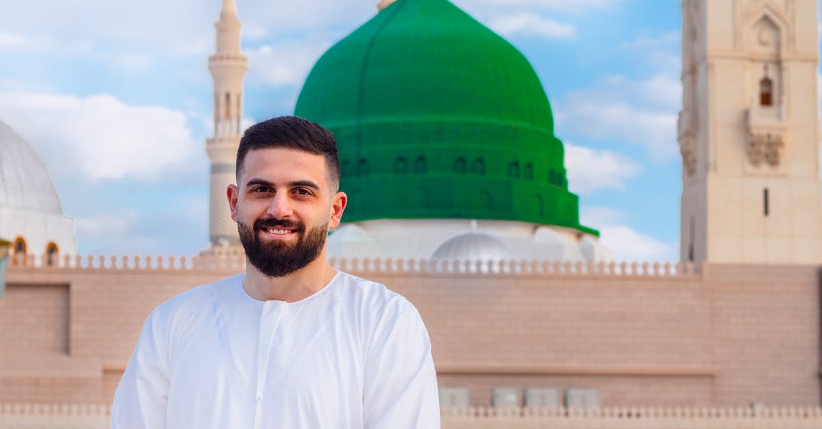 How much does it cost for a visitor visa to Saudi Arabia? - Man In White Long Sleeve Shirt Standing Near A Mosque How much does it cost for a visitor visa to Saudi Arabia? - Man In White Long Sleeve Shirt Standing Near A Mosque