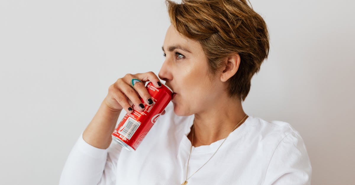How much gold can be transferred between EU countries? - Pensive female in white wear with gold necklace and ring on finger drinking cold coke from red can and looking away How much gold can be transferred between EU countries? - Pensive female in white wear with gold necklace and ring on finger drinking cold coke from red can and looking away