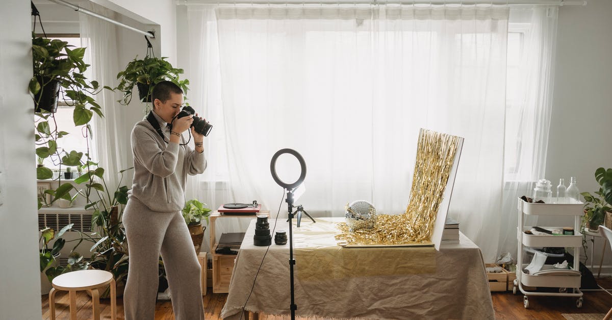 How much time it takes to transfer an Australia visa to a new passport using Form 929? - Photographer taking photo of tinsel on digital camera at home