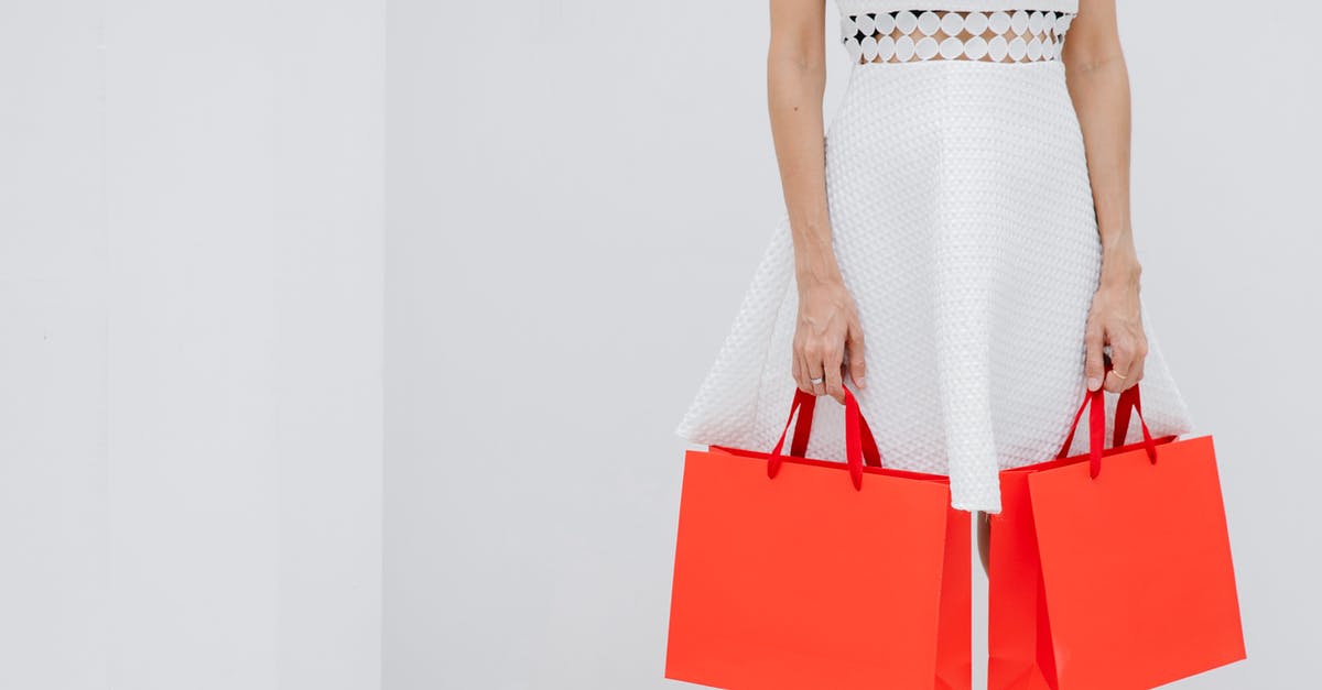 How often does United offer bonus miles for purchase? - Crop unrecognizable woman carrying red shopping bags in studio How often does United offer bonus miles for purchase? - Crop unrecognizable woman carrying red shopping bags in studio