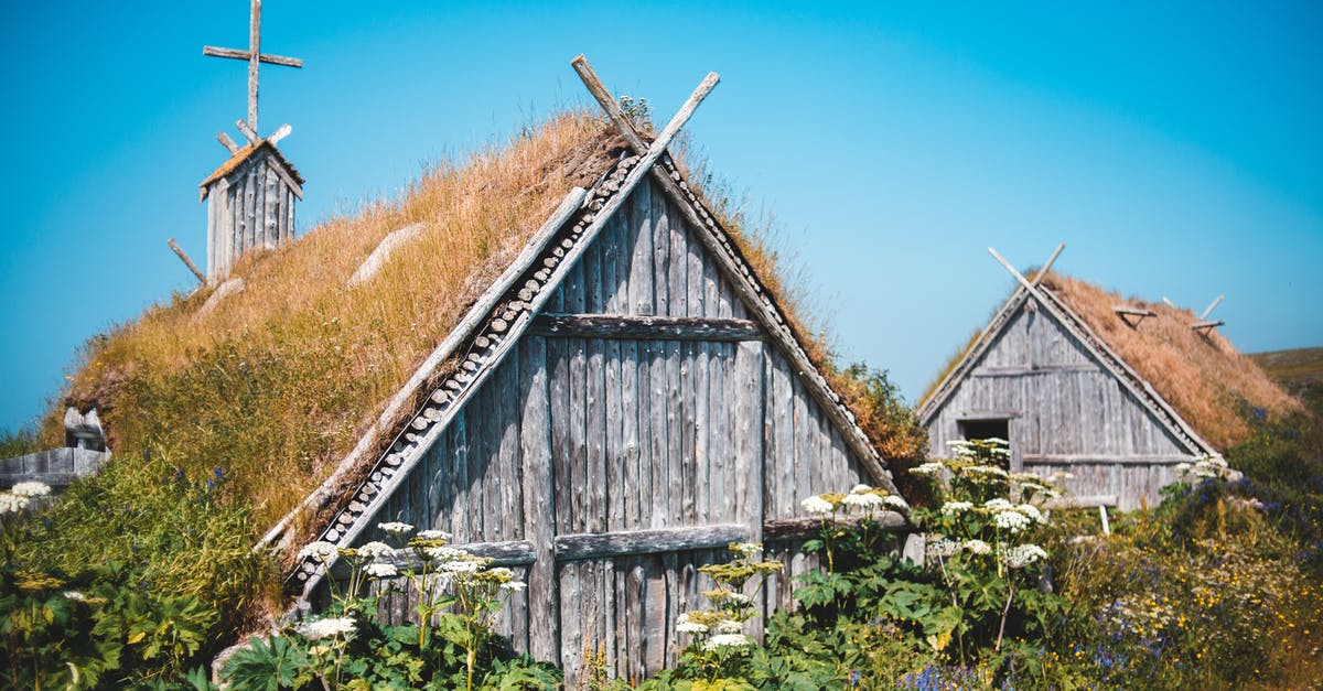 How old do you have to be to get into Canada by yourself? - Exterior of lumber shed and church among lush green plants in traditional Norstead Viking Village against cloudless blue sky How old do you have to be to get into Canada by yourself? - Exterior of lumber shed and church among lush green plants in traditional Norstead Viking Village against cloudless blue sky