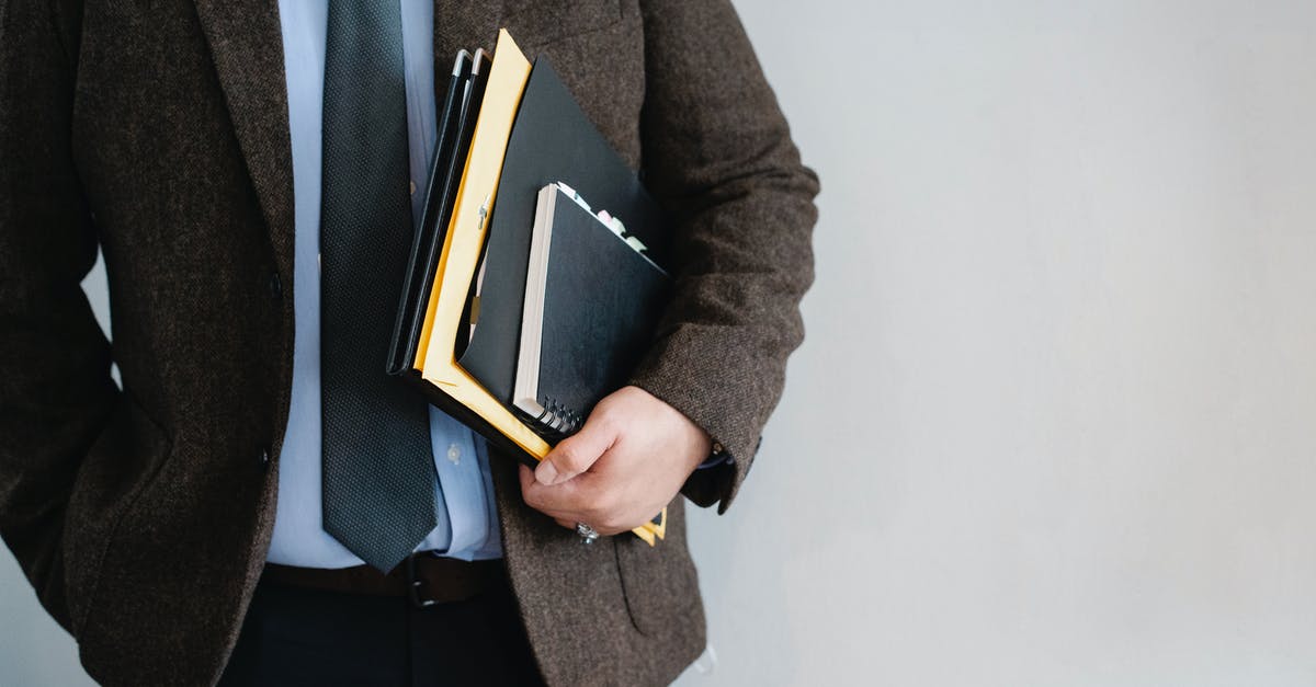 How reliable is the Salzburg-Budapest Railjet? - Crop unrecognizable office worker standing with papers in hand How reliable is the Salzburg-Budapest Railjet? - Crop unrecognizable office worker standing with papers in hand
