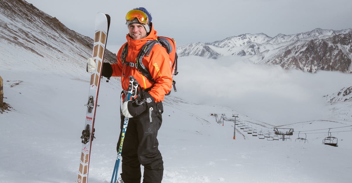How safe are cable cars? - Man Wearing Orange and Black Snowsuit With Ski Set on Snow Near Cable Cars How safe are cable cars? - Man Wearing Orange and Black Snowsuit With Ski Set on Snow Near Cable Cars