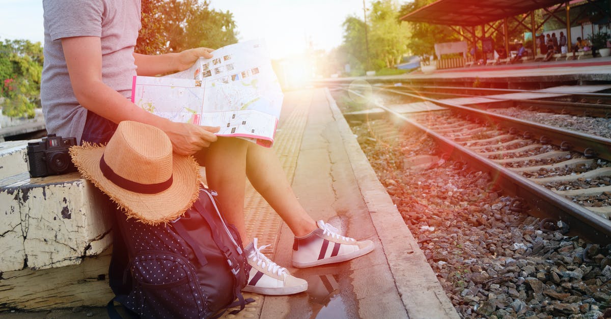 How safe is travelling on European rail networks for solo travellers? - Man Sitting Beside Black Backpack Near Railway How safe is travelling on European rail networks for solo travellers? - Man Sitting Beside Black Backpack Near Railway