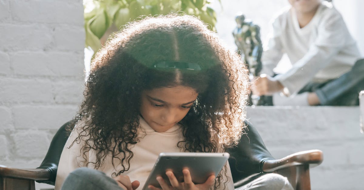How serious was my sister's Schengen overstay? - Serious ethnic little girl using tablet during weekend at home with sibling How serious was my sister's Schengen overstay? - Serious ethnic little girl using tablet during weekend at home with sibling