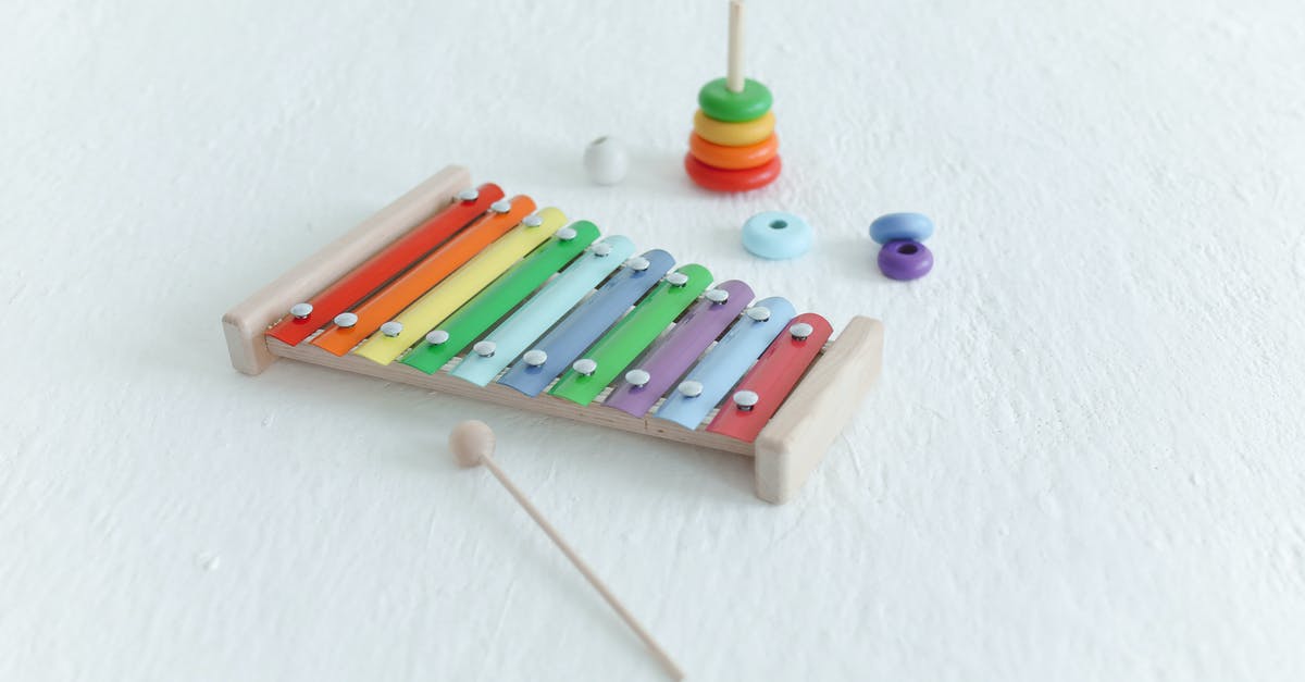 How should I be stacking luggage? - Developmental Toys on White Surface How should I be stacking luggage? - Developmental Toys on White Surface