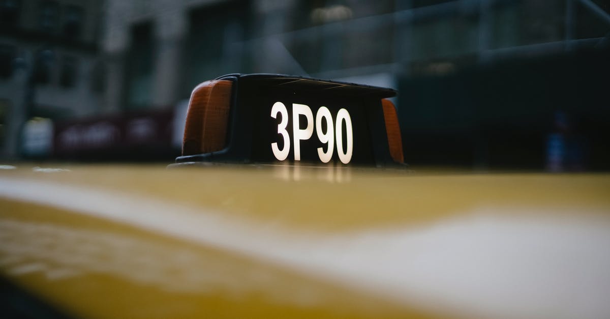 How to access Killarney Provincial park (Ontario) by public transportation - Modern yellow taxi roof with number sign on black background How to access Killarney Provincial park (Ontario) by public transportation - Modern yellow taxi roof with number sign on black background