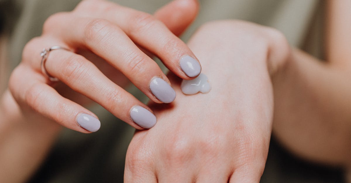 How to apply for a German Schengen visa, staying in a small hotel with no registration # - Crop woman with ring applying hand cream