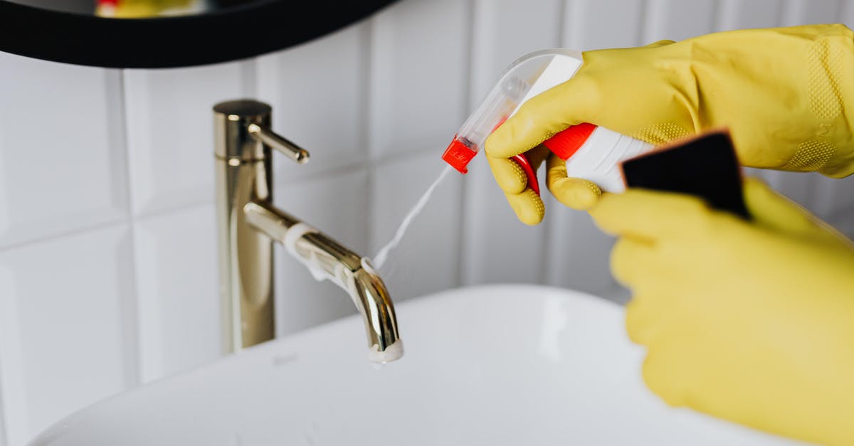 How to apply for a Hong Kong visa from Macao? - From above anonymous housekeeper in yellow rubber gloves spraying cleaner to chrome water faucet in bathroom How to apply for a Hong Kong visa from Macao? - From above anonymous housekeeper in yellow rubber gloves spraying cleaner to chrome water faucet in bathroom