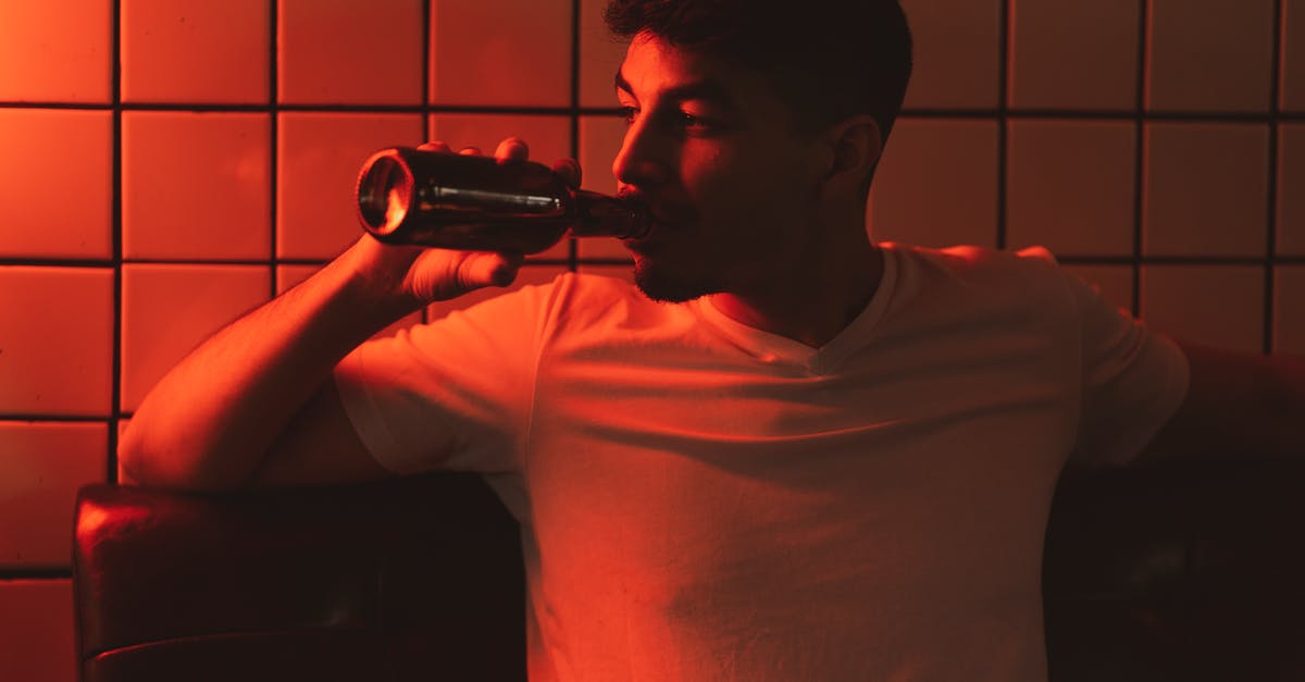 How to avoid drinking vodka? - Man in White Crew Neck T-shirt Drinking from Bottle How to avoid drinking vodka? - Man in White Crew Neck T-shirt Drinking from Bottle