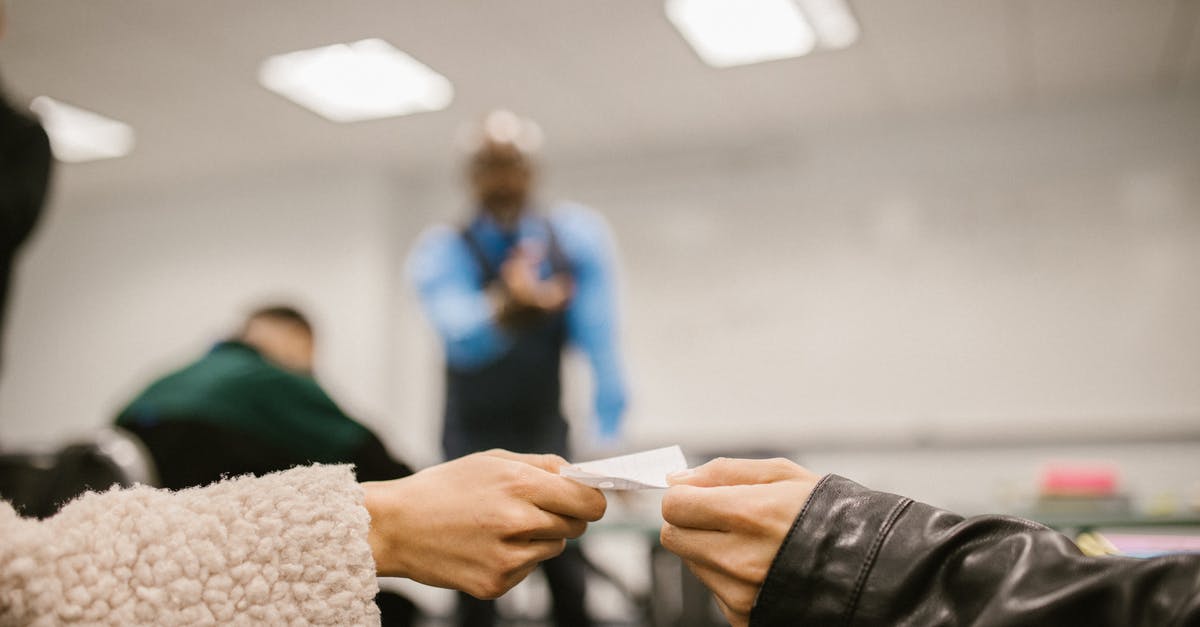 How to avoid getting hassled in Indonesia? - Shallow Focus Photo of Students Cheating During an Exam How to avoid getting hassled in Indonesia? - Shallow Focus Photo of Students Cheating During an Exam