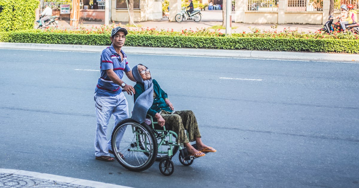 How to avoid getting motion sickness? - Man Pushing A Woman Sitting on Wheelchair How to avoid getting motion sickness? - Man Pushing A Woman Sitting on Wheelchair