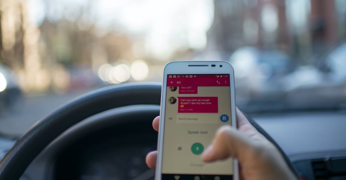 How to avoid losing someone while traveling? - Person Holding White Smartphone Inside Vehicle How to avoid losing someone while traveling? - Person Holding White Smartphone Inside Vehicle