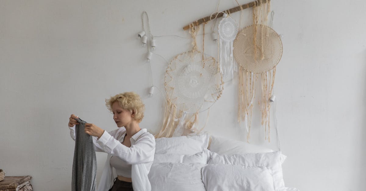 How to avoid taking bed bugs along with the luggage - Calm woman packing luggage in bedroom How to avoid taking bed bugs along with the luggage - Calm woman packing luggage in bedroom