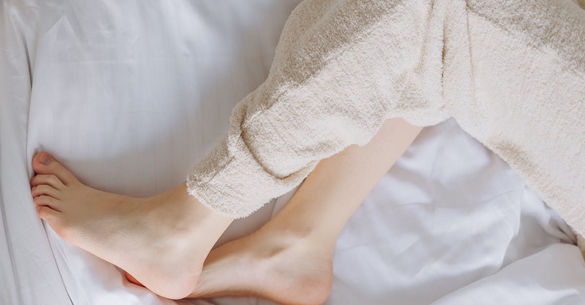 How to book an early morning taxi to Rome Airport? - Person in White Pants Lying on White Bed How to book an early morning taxi to Rome Airport? - Person in White Pants Lying on White Bed