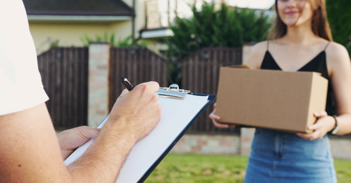 How to book courier flights (discounted fare in exchange for delivering a package upon arrival)? - Person Holding Black Pen Writing on White Paper