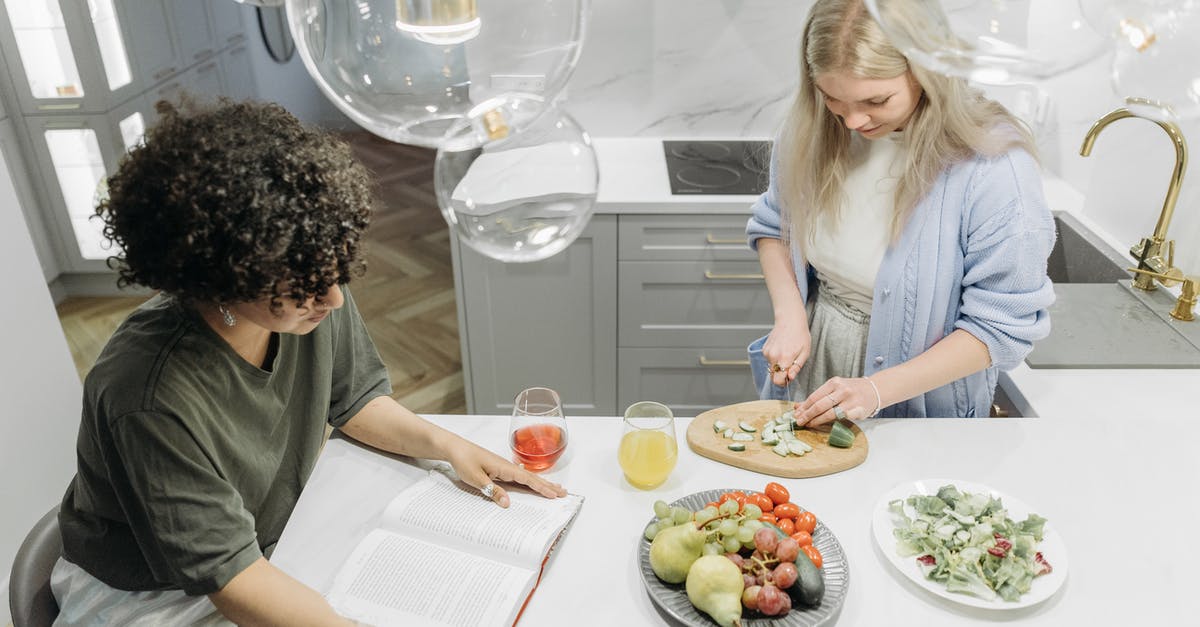 How to book hotels as an unmarried couple in Dubai? [duplicate] - Woman in White Long Sleeve Shirt Sitting Beside Woman in White Long Sleeve Shirt