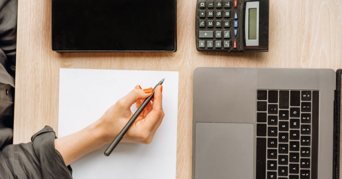 How to calculate if my battery will be allowed in hand luggage? (Voltage in mAh to Wh conversion) - Person Holding a Pen on Top of a Desk How to calculate if my battery will be allowed in hand luggage? (Voltage in mAh to Wh conversion) - Person Holding a Pen on Top of a Desk
