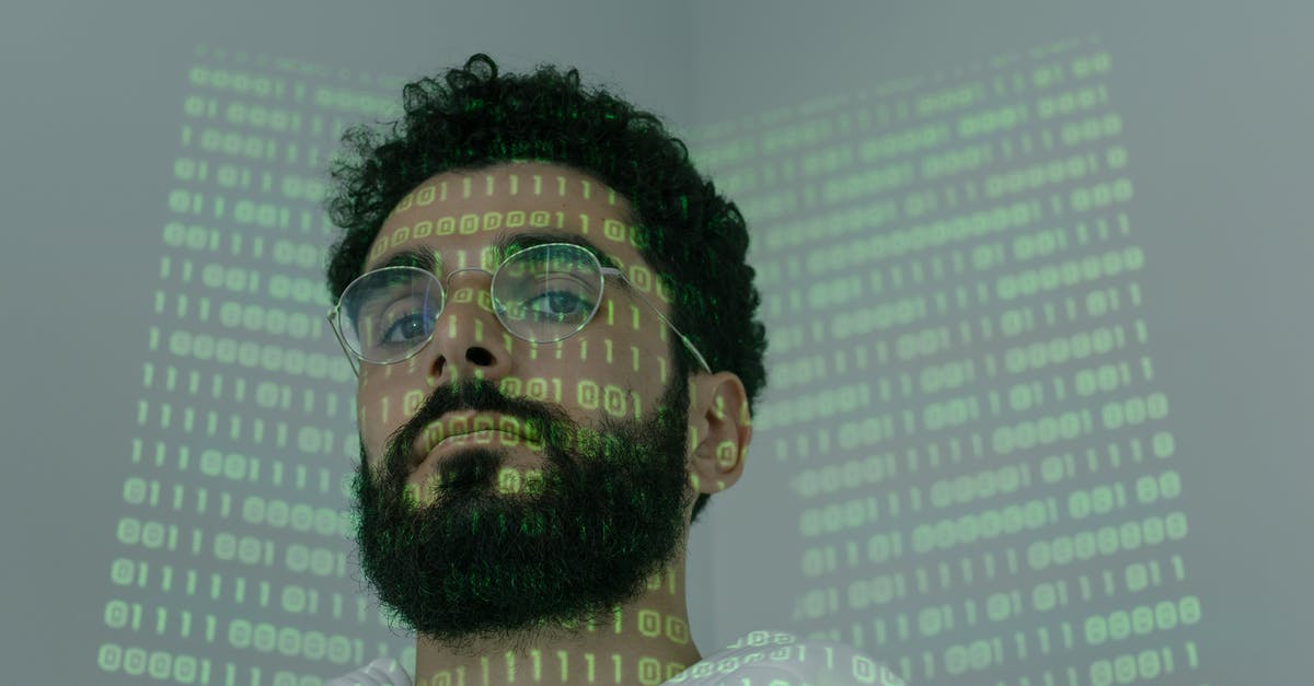 How to change my loyalty program online before check-in? - Man With Binary Code Projected on His Face How to change my loyalty program online before check-in? - Man With Binary Code Projected on His Face