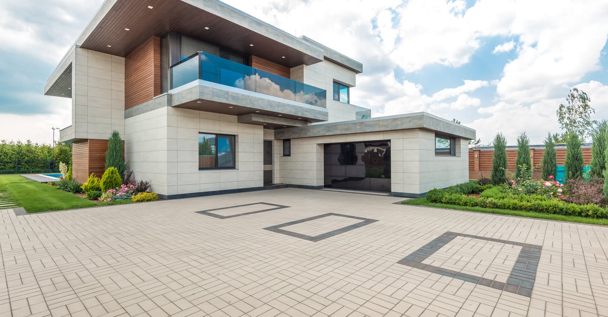 How to change my residence address for NEXUS? - Brown and White Concrete House Under White Clouds