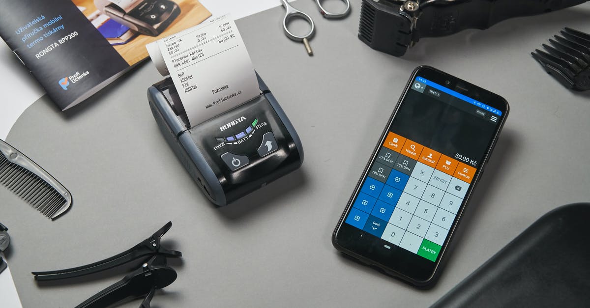How to check the status of an application for a UK work visa for an Indian? [closed] - Cash register and calculator on smartphone in barber shop