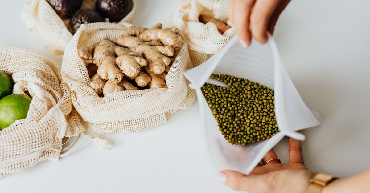 How to combine multiple bags into a single checked item? - Person Holding Brown and White Nuts How to combine multiple bags into a single checked item? - Person Holding Brown and White Nuts