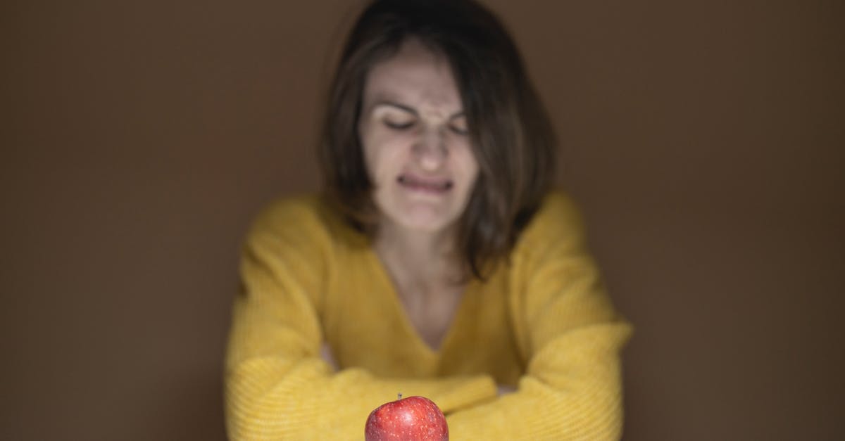 How to cope with disgusting fellow travellers? - Woman Disgusted Looking at the Apple How to cope with disgusting fellow travellers? - Woman Disgusted Looking at the Apple