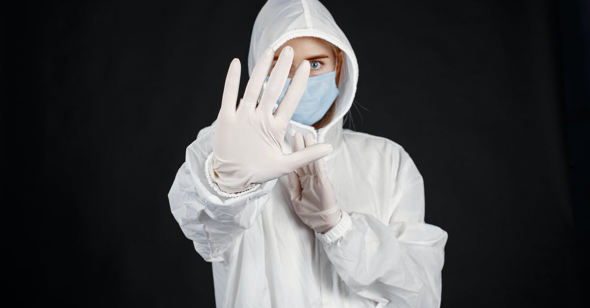 How to deal with a fear of driving? - Person in Protective Suit against Coronavirus How to deal with a fear of driving? - Person in Protective Suit against Coronavirus