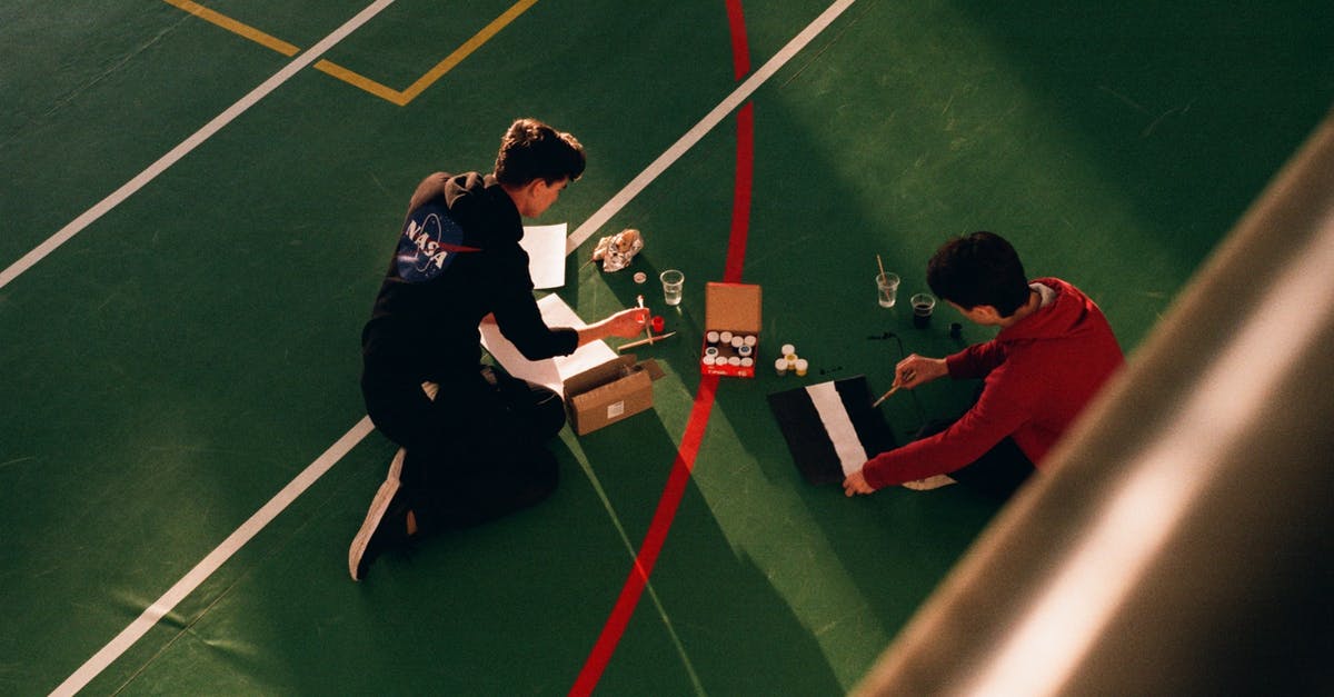 How to decide the boundary line between being polite and being firm? [closed] - Anonymous men painting marking lines on sports court