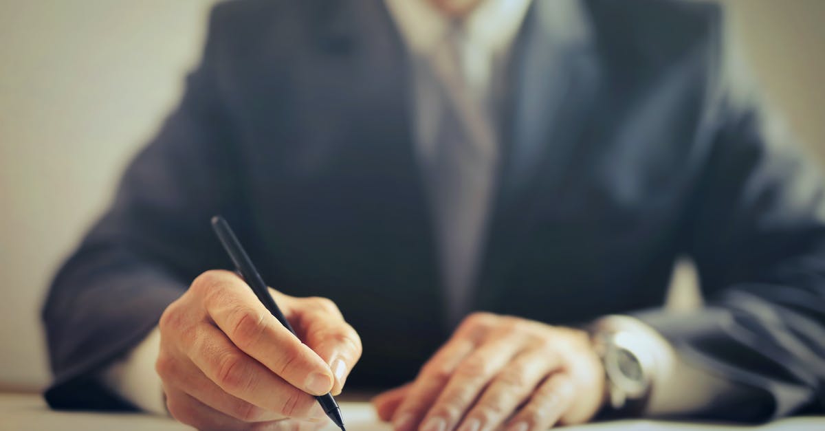 How to determine if a hostel room is a walk-through room? - Crop businessman signing contract in office