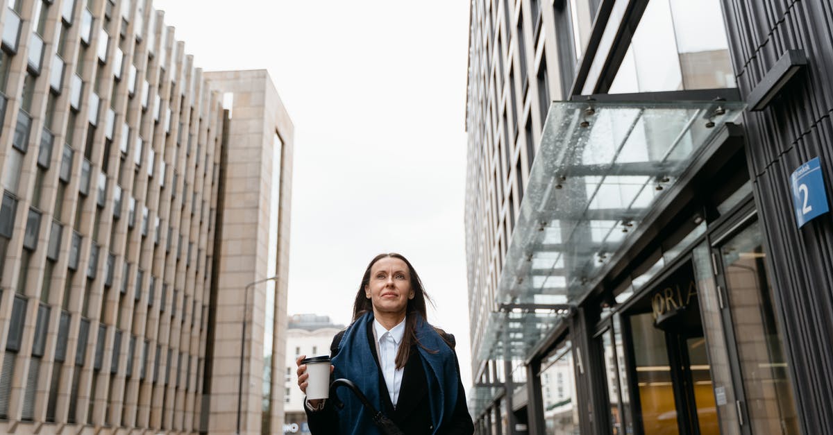How to divide large bank notes into smaller ones while traveling? - Woman in Black Coat Standing Near Building How to divide large bank notes into smaller ones while traveling? - Woman in Black Coat Standing Near Building