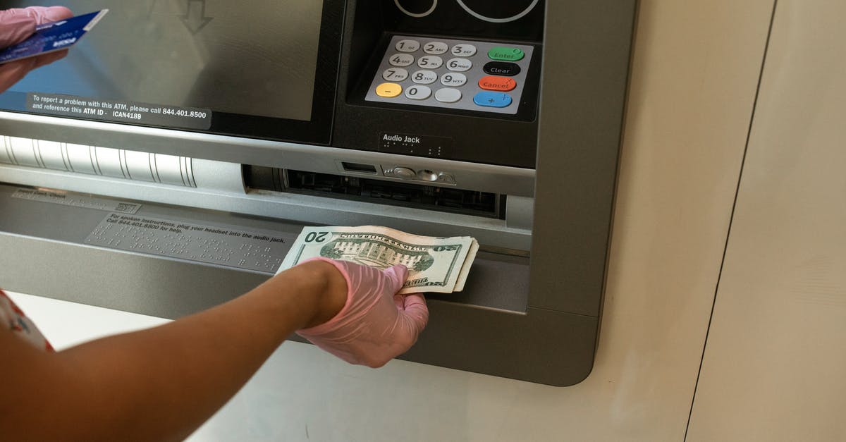 How to draw cash when ATM does not accept card? - Person Deposits Money on an ATM How to draw cash when ATM does not accept card? - Person Deposits Money on an ATM